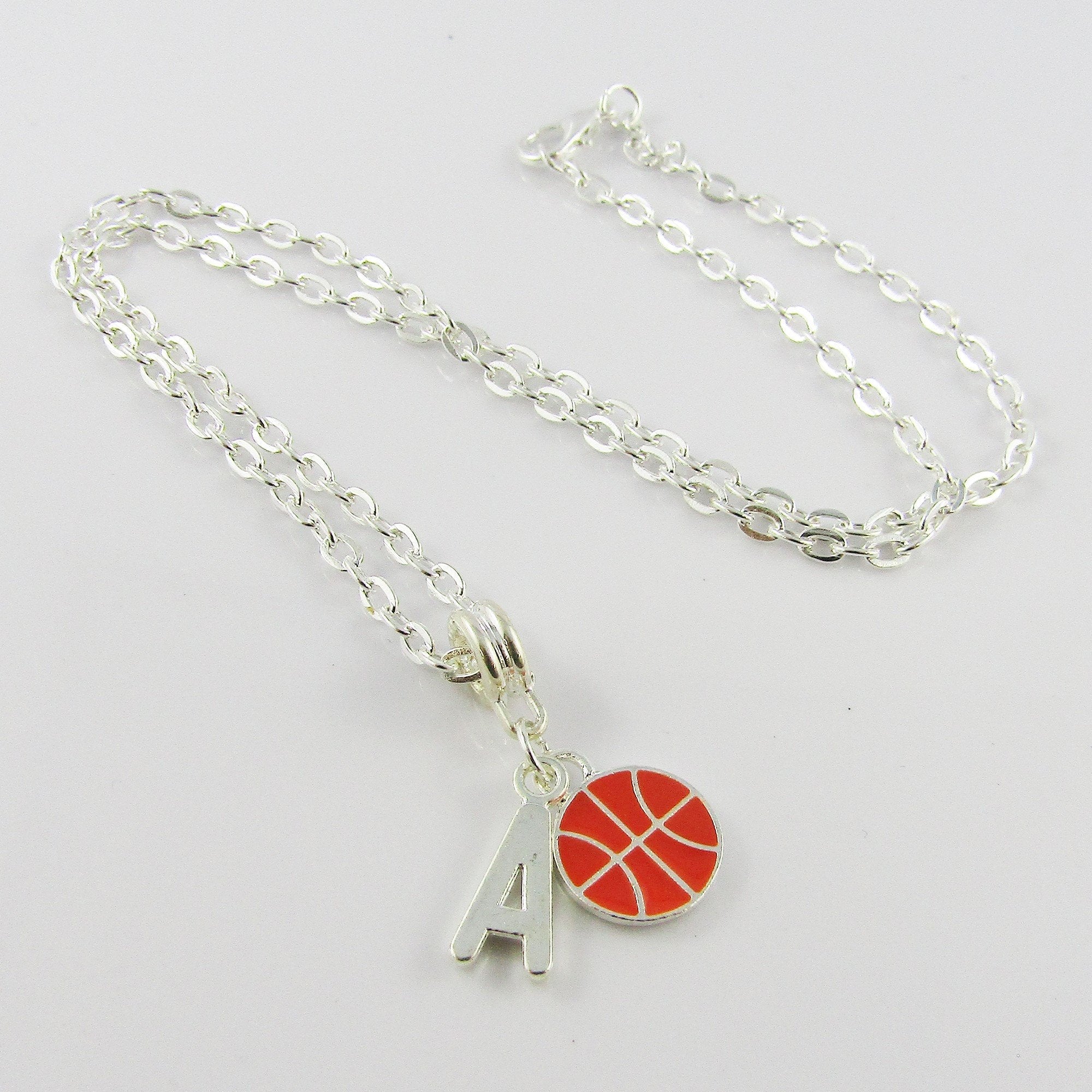 Gold chain with basketball on sale charm